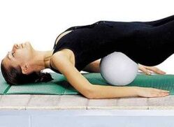 Exercise with a roller under the lower back